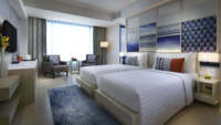 Deluxe Zweibettzimmer mit Poolblick